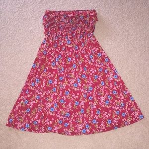Super fun and frilly sleeveless dress. One size